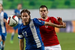 Budapest, Hungary - November 14, 2014: Duel between Hunagrian Nemanja Nikolic (r) and Finnish Jarkko Hurme during Hungary vs. Finland football match in Groupama Arena on November 14, 2014 in Budapest, Hungary.